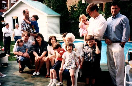 From the right,Curt, Chad and Meagan  - Matthew, Maud, Chelsea and Sean  -  Kerri, Patrizia, Cathy, ken and Laura  -   Bill and Alex with Rudy and Ken in the background, discussing the Stock Market.